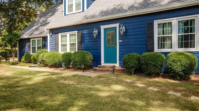 a view of a house with a garden