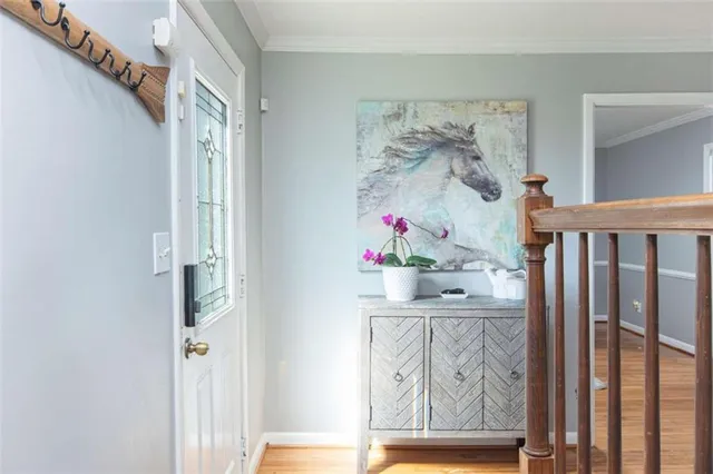a view of room with wooden floor and fan
