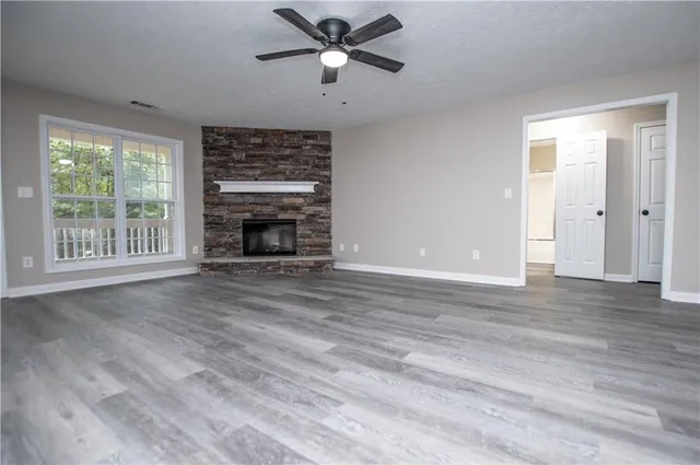 a kitchen with stainless steel appliances granite countertop cabinets and a microwave oven