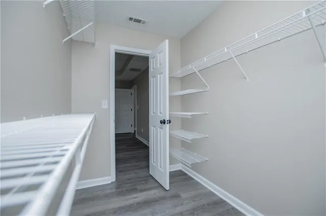 a view of a house with yard and sitting area