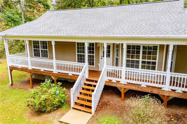 a backyard of a house with a bench