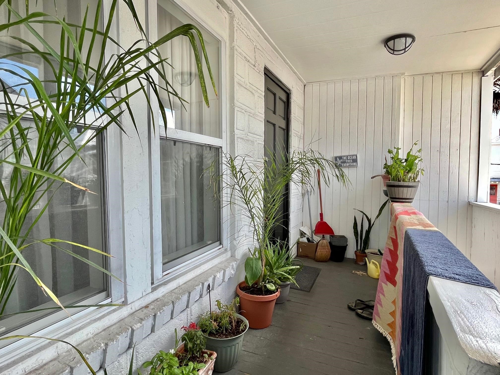 138 King Street, Unit D St. Augustine, FL 32084 - Photo 3 of 12 a view of porch with seating space
