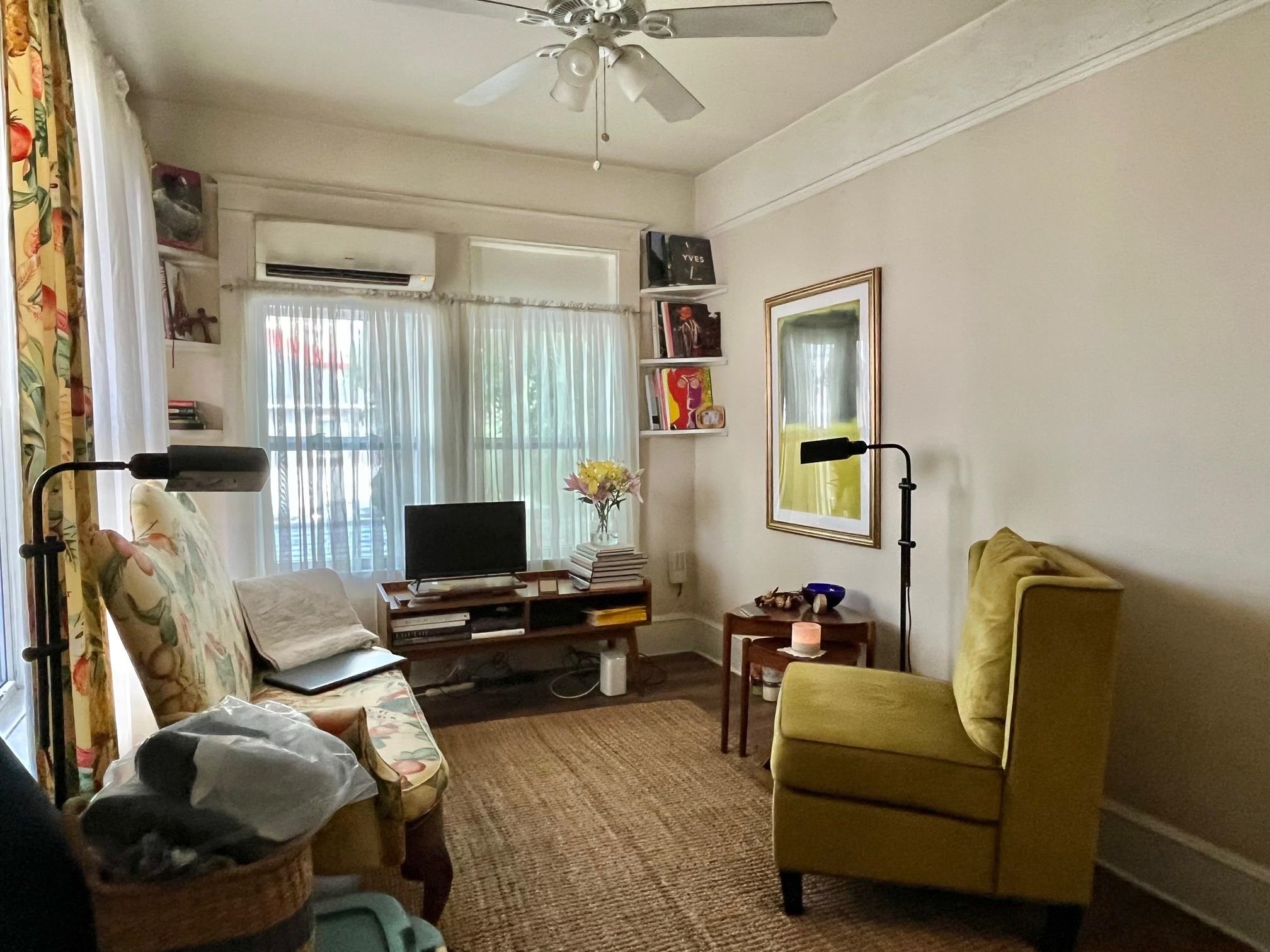 138 King Street, Unit D St. Augustine, FL 32084 - Photo 5 of 12 a living room with furniture a flat screen tv and a window