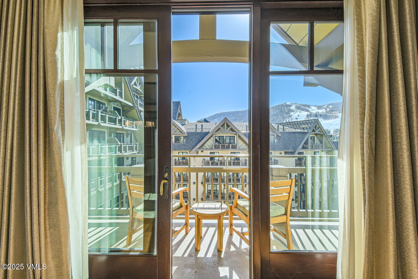 1 Vail Road, Unit 8101F Vail, CO 81657 - Photo 1 of 28 a view of a room with a large window and front door