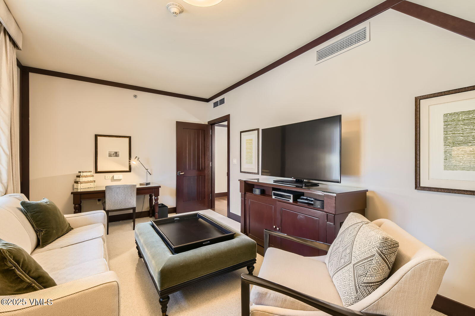 1 Vail Road, Unit 8101F Vail, CO 81657 - Photo 13 of 28 a living room with furniture and a flat screen tv