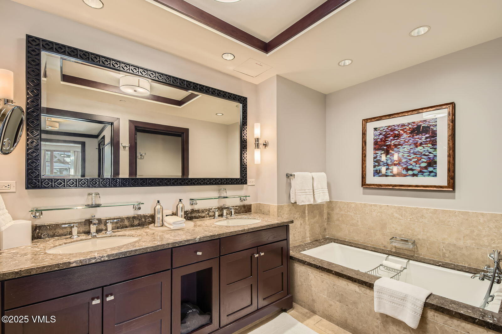 1 Vail Road, Unit 8101F Vail, CO 81657 - Photo 18 of 28 a bathroom with a granite countertop double vanity sink and a mirror