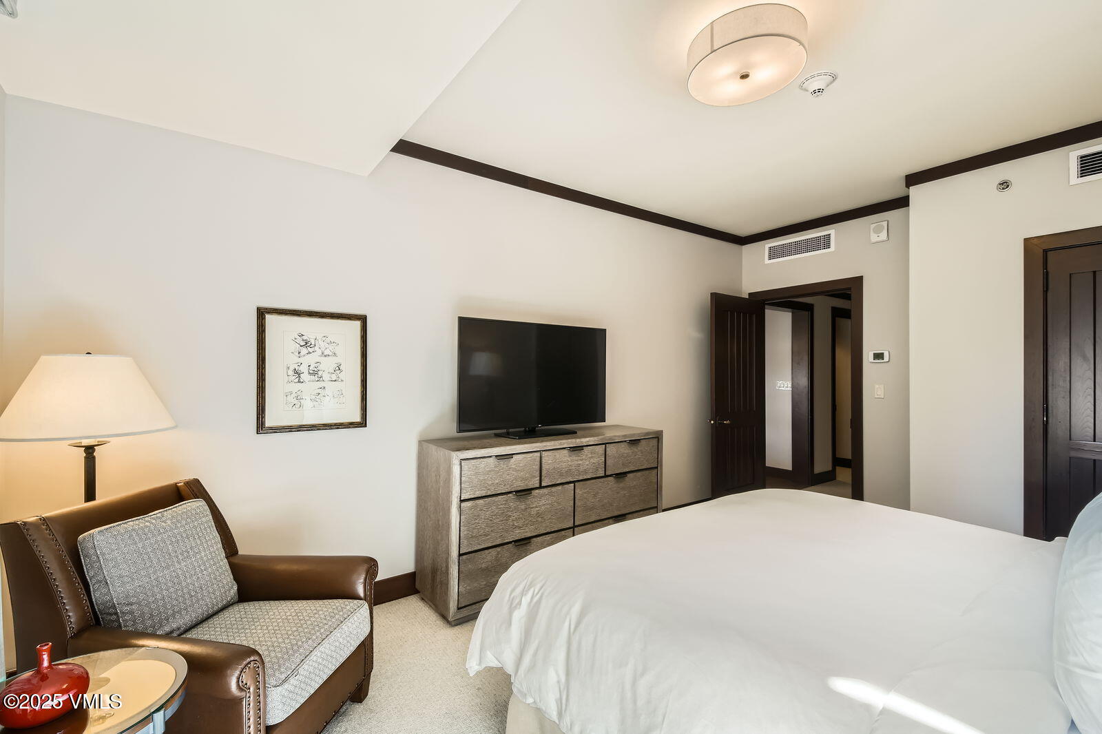 1 Vail Road, Unit 8101F Vail, CO 81657 - Photo 23 of 28 a bedroom with a bed and a flat screen tv