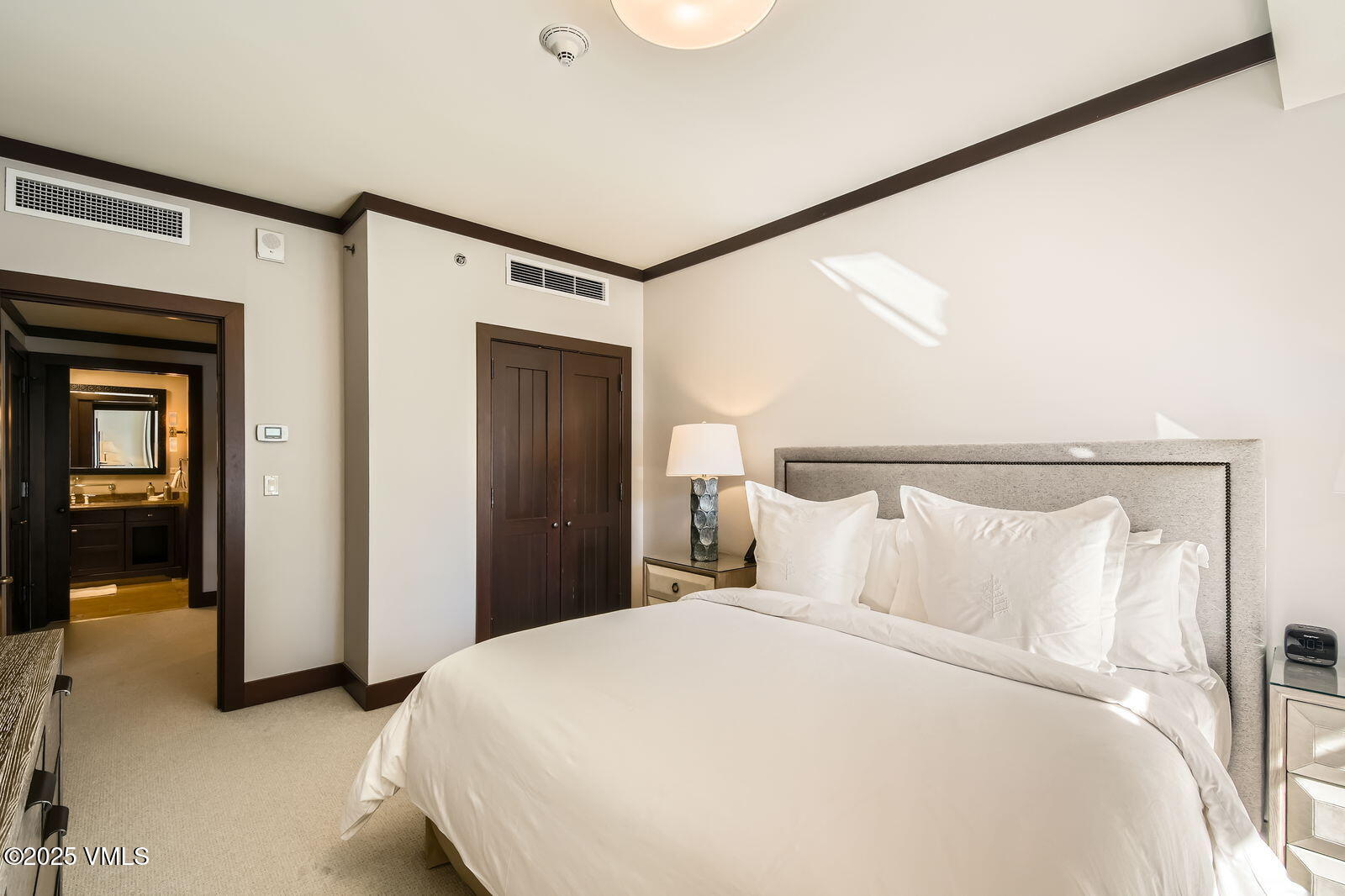 1 Vail Road, Unit 8101F Vail, CO 81657 - Photo 24 of 28 a bedroom with a bed and a walk in closet