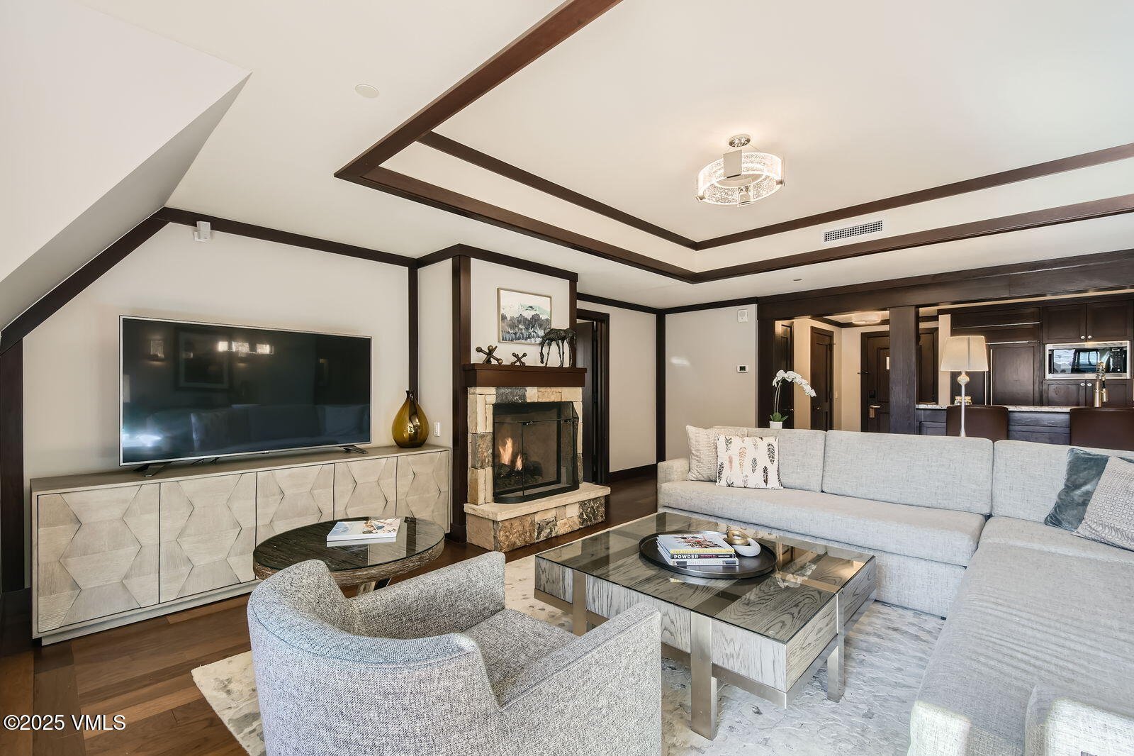 1 Vail Road, Unit 8101F Vail, CO 81657 - Photo 3 of 28 a living room with furniture and a flat screen tv