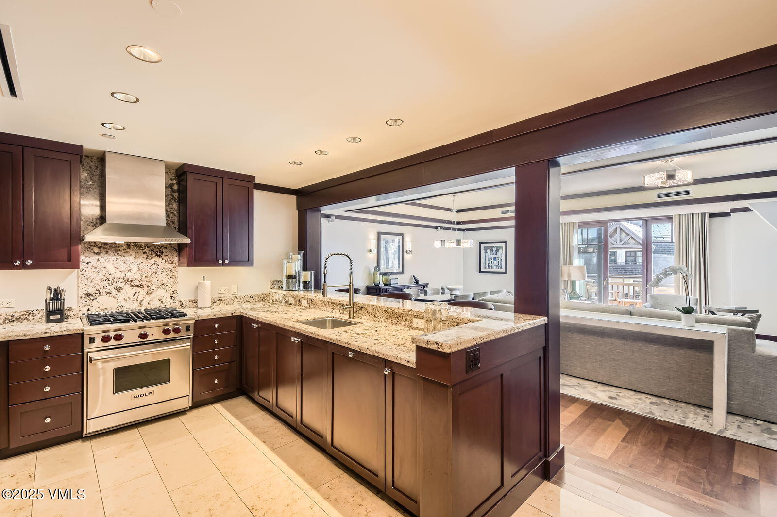 1 Vail Road, Unit 8101F Vail, CO 81657 - Photo 8 of 28 a kitchen with stainless steel appliances granite countertop a stove and a sink