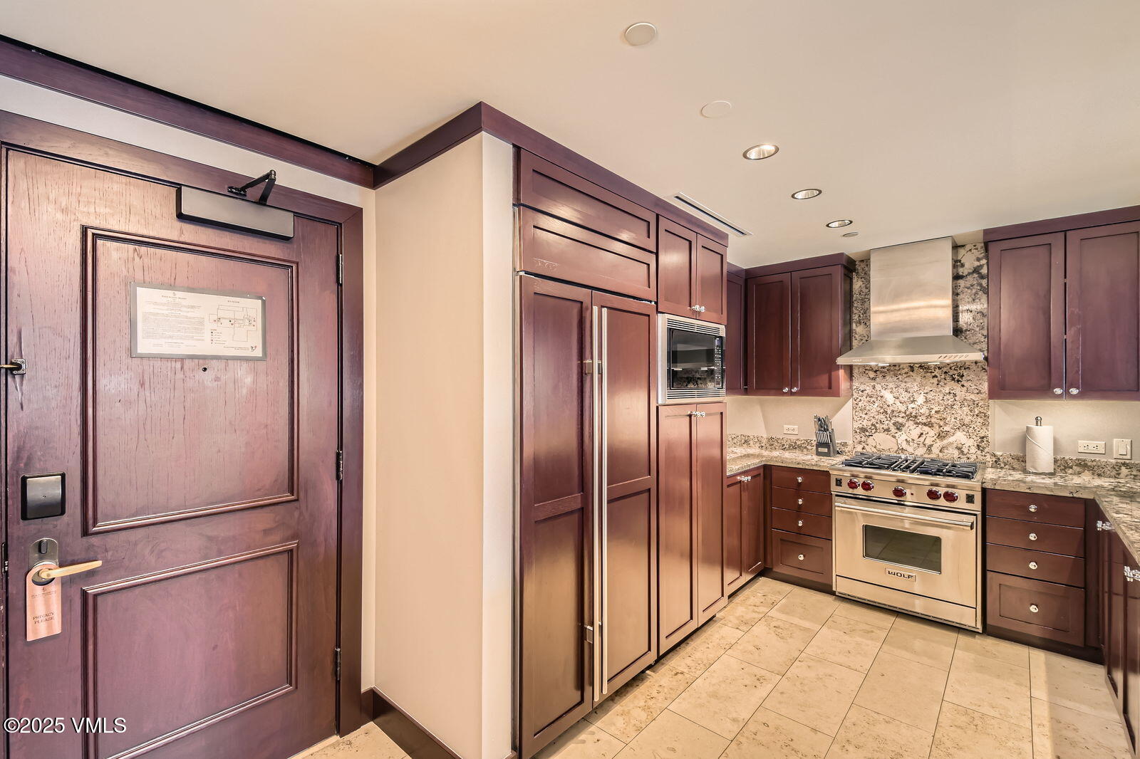 1 Vail Road, Unit 8101F Vail, CO 81657 - Photo 9 of 28 a kitchen with stainless steel appliances granite countertop a refrigerator and a sink
