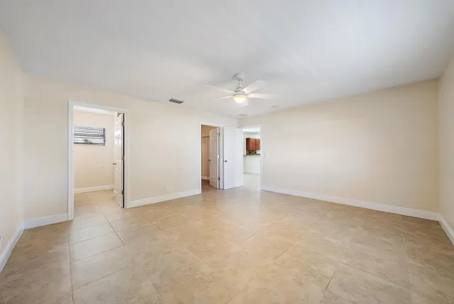 an empty room with a bathroom