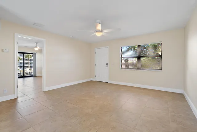 a view of an empty room with a window