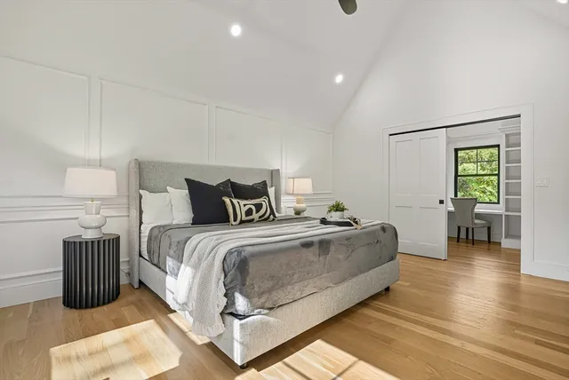 a spacious bedroom with a bed and a couch