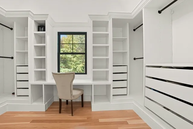 a view of a room with chairs and stairs