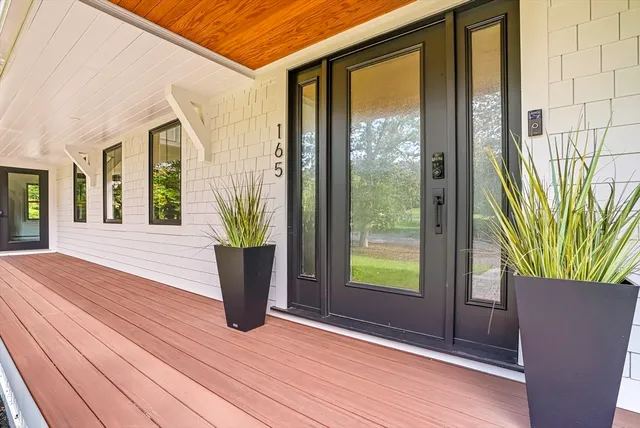 a view of a two chairs in the porch