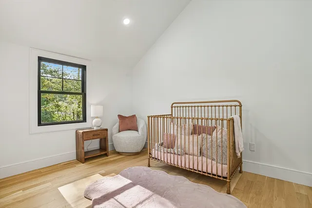 a bedroom with furniture and a window
