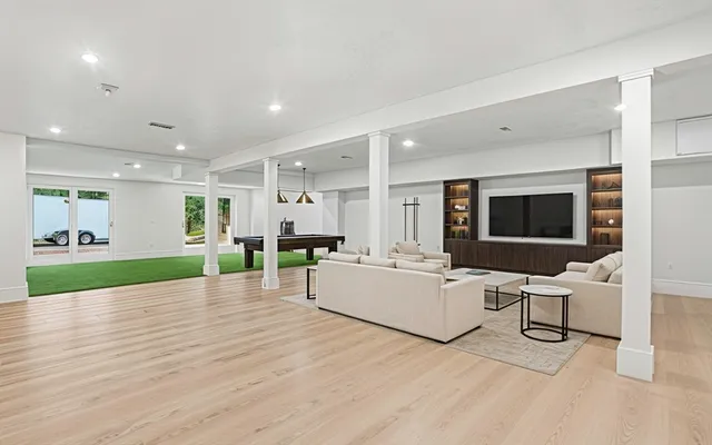 a living room with furniture and a flat screen tv