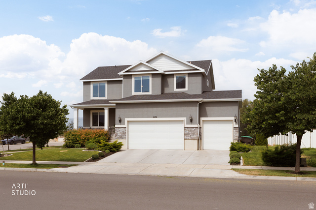 1654 South 730 West Provo, UT 84601 - Photo 1 of 33 Two-story residence featuring a gray stucco exterior with white trim accents and a dark shingle roof