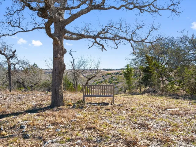a view of a backyard of the house