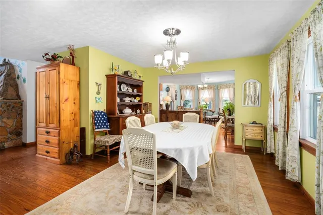 a kitchen with stainless steel appliances sink microwave and wooden floor