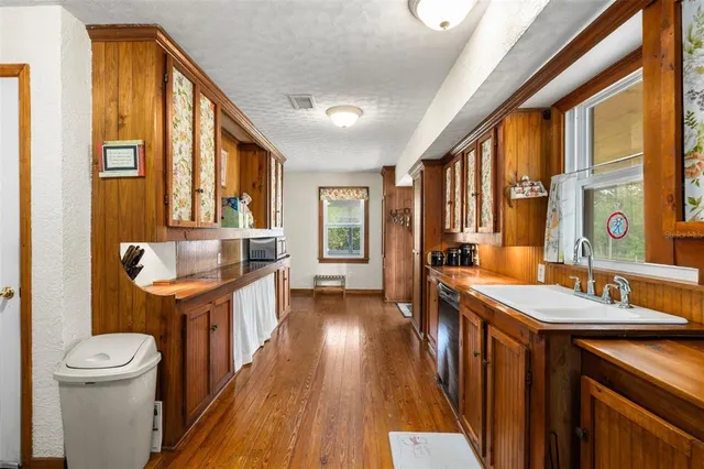 a kitchen with stainless steel appliances a refrigerator and a stove top oven
