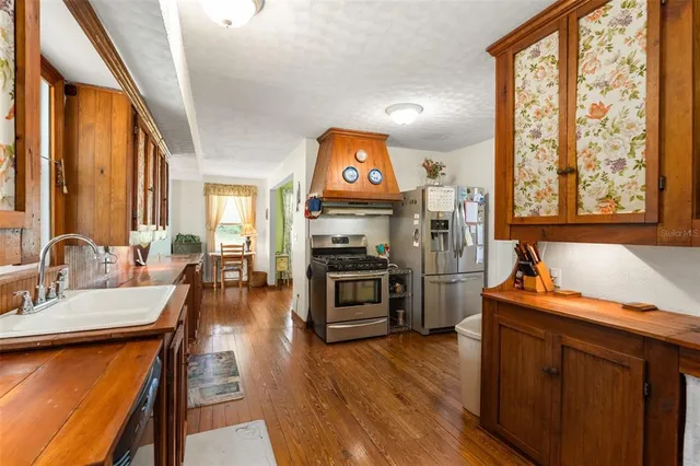 a bedroom with furniture and a flat screen tv