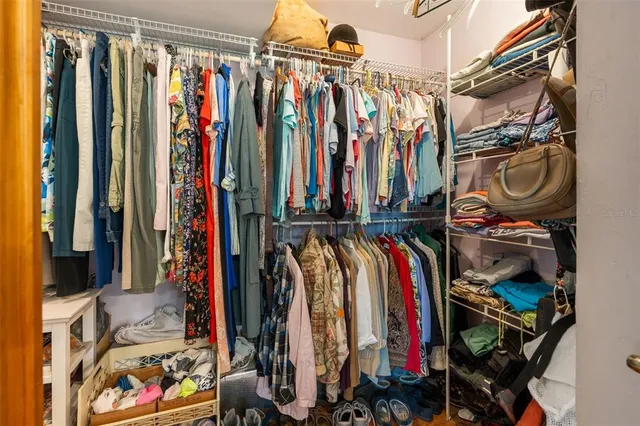 a bed room with a bed and a chandelier