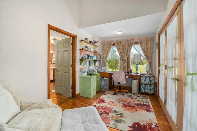 a bedroom with a bed and a large mirror