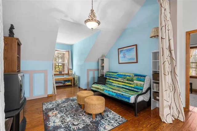 a view of a house with pool and chairs
