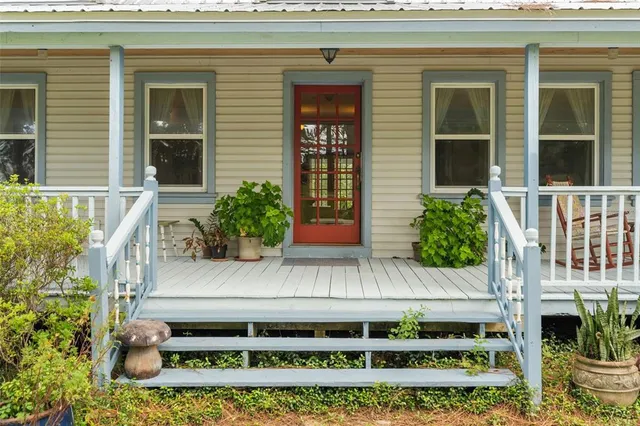 a view of a lake with a house in a garden
