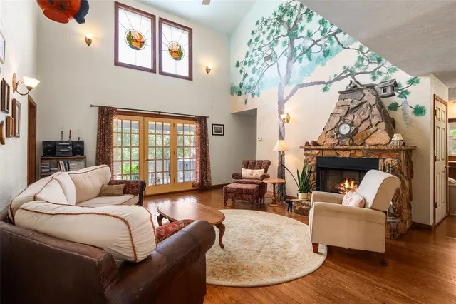 a view of a dining room with furniture wooden floor and chandelier