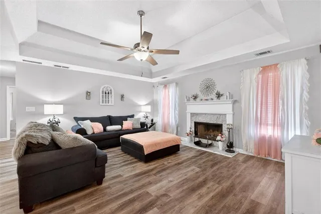 a living room with furniture and a fireplace