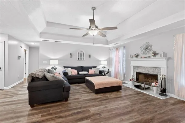 a living room with furniture and a fireplace