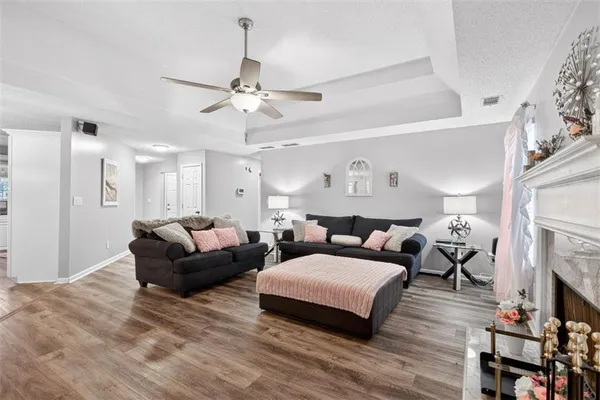 a living room with furniture and a fireplace