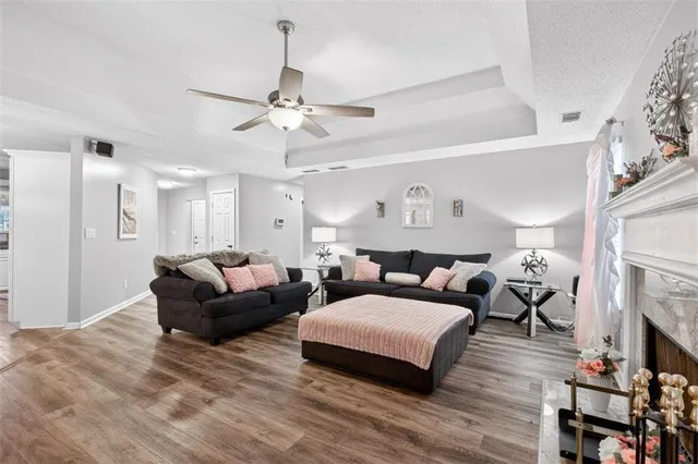 a living room with furniture and a fireplace