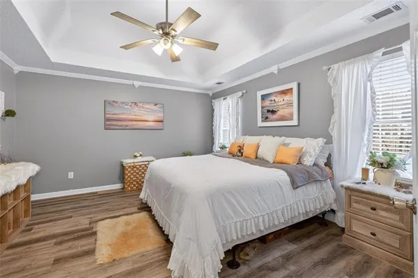 a bathroom with a granite countertop sink a large mirror and a shower