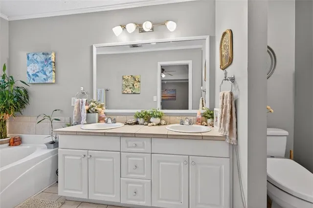 a living room with lots of clothes and shoes