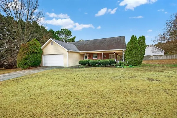 a view of a house with a yard