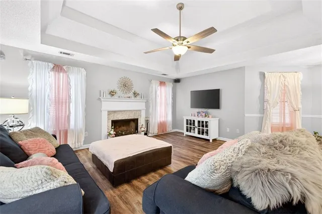 a living room with furniture and a fireplace