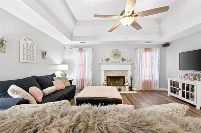 a spacious bedroom with a bed and a chandelier