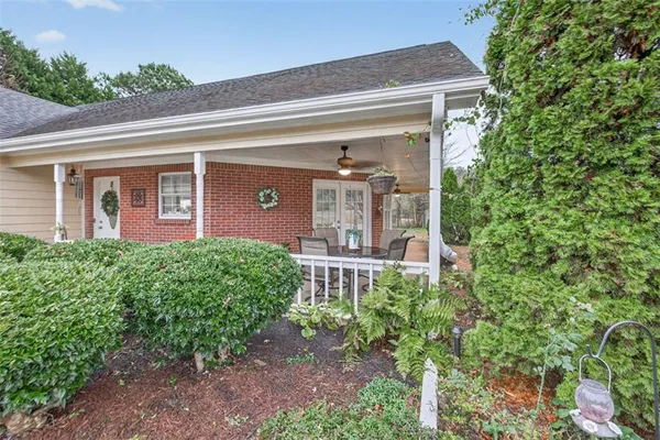 a front view of a house with garden