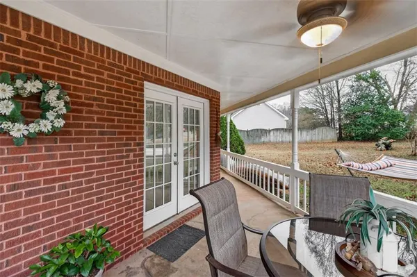 a view of a chair and table in the balcony