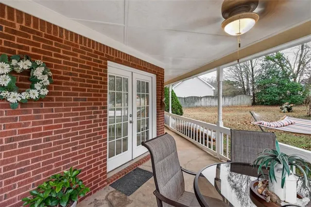 a view of a chair and table in the balcony