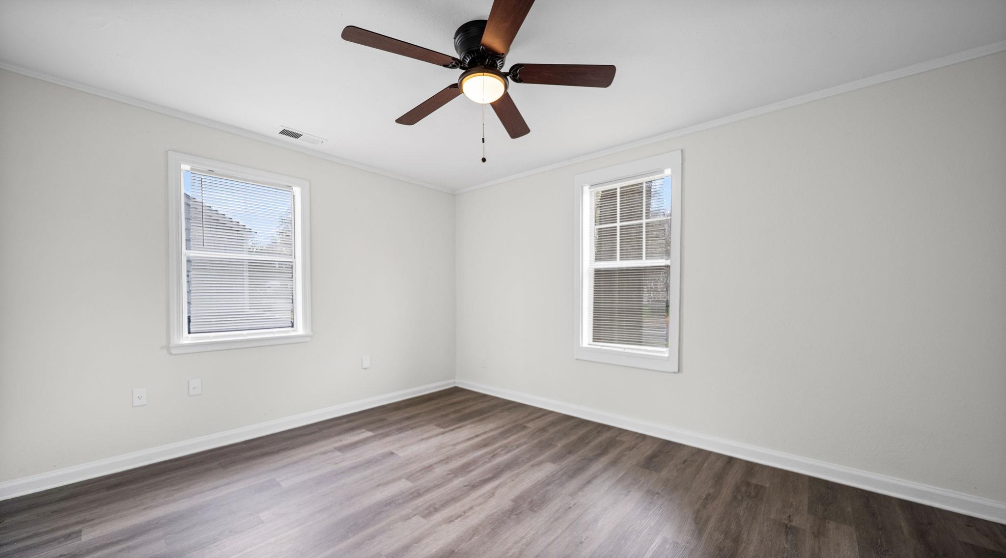 4408 Given Avenue Memphis, TN 38122 - Photo 11 of 16 a view of an empty room with wooden floor and a window