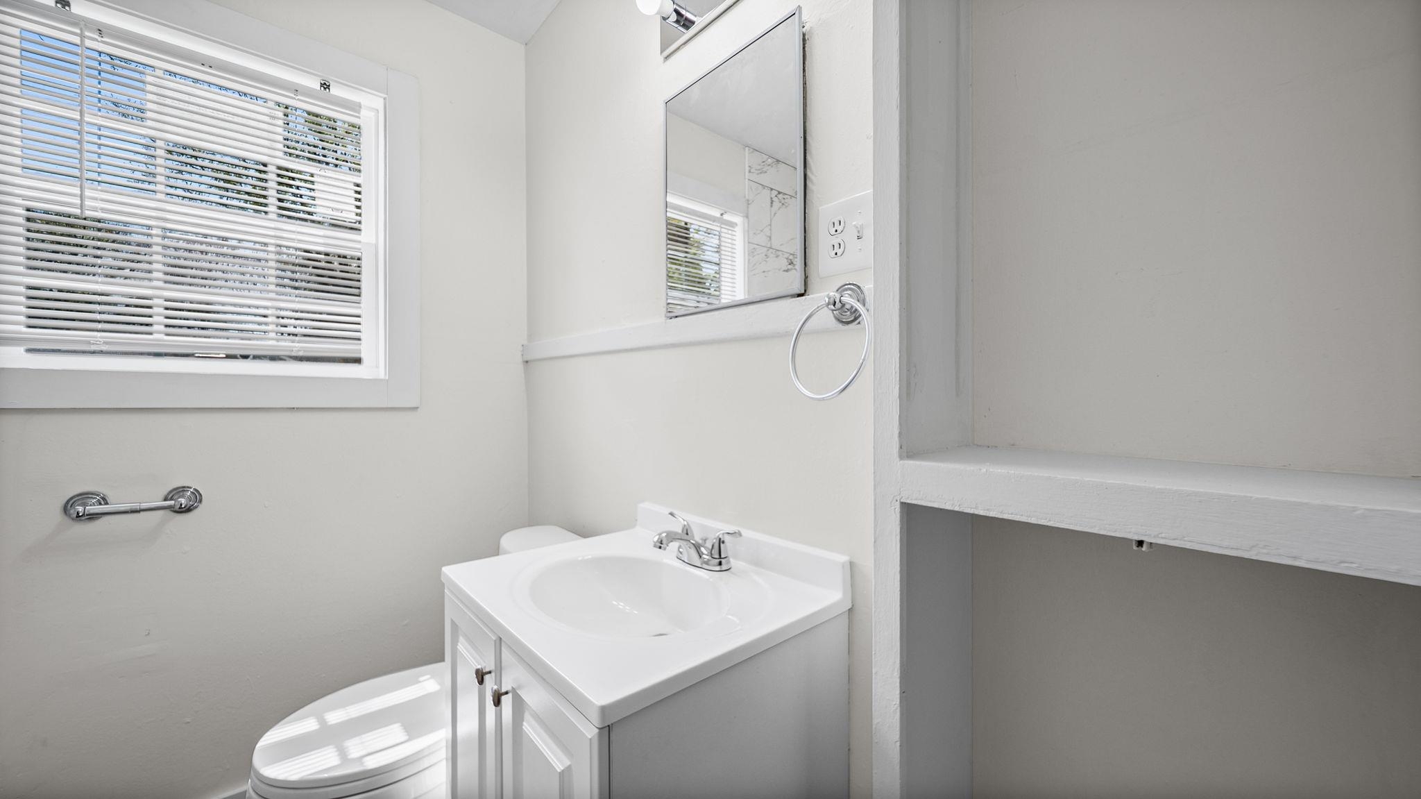 4408 Given Avenue Memphis, TN 38122 - Photo 14 of 16 a bathroom with a sink toilet and vanity
