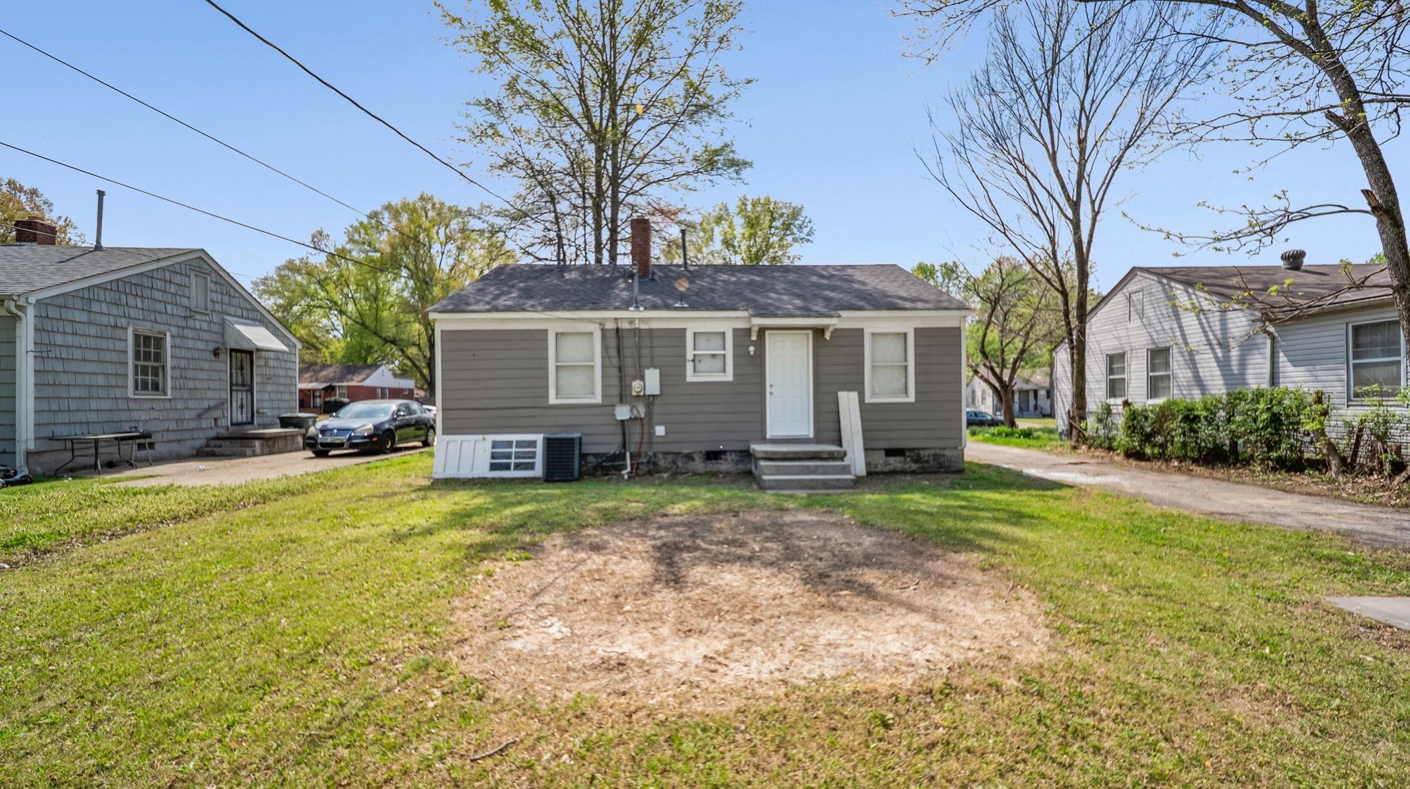 4408 Given Avenue Memphis, TN 38122 - Photo 15 of 16 a view of a house with a yard and large tree