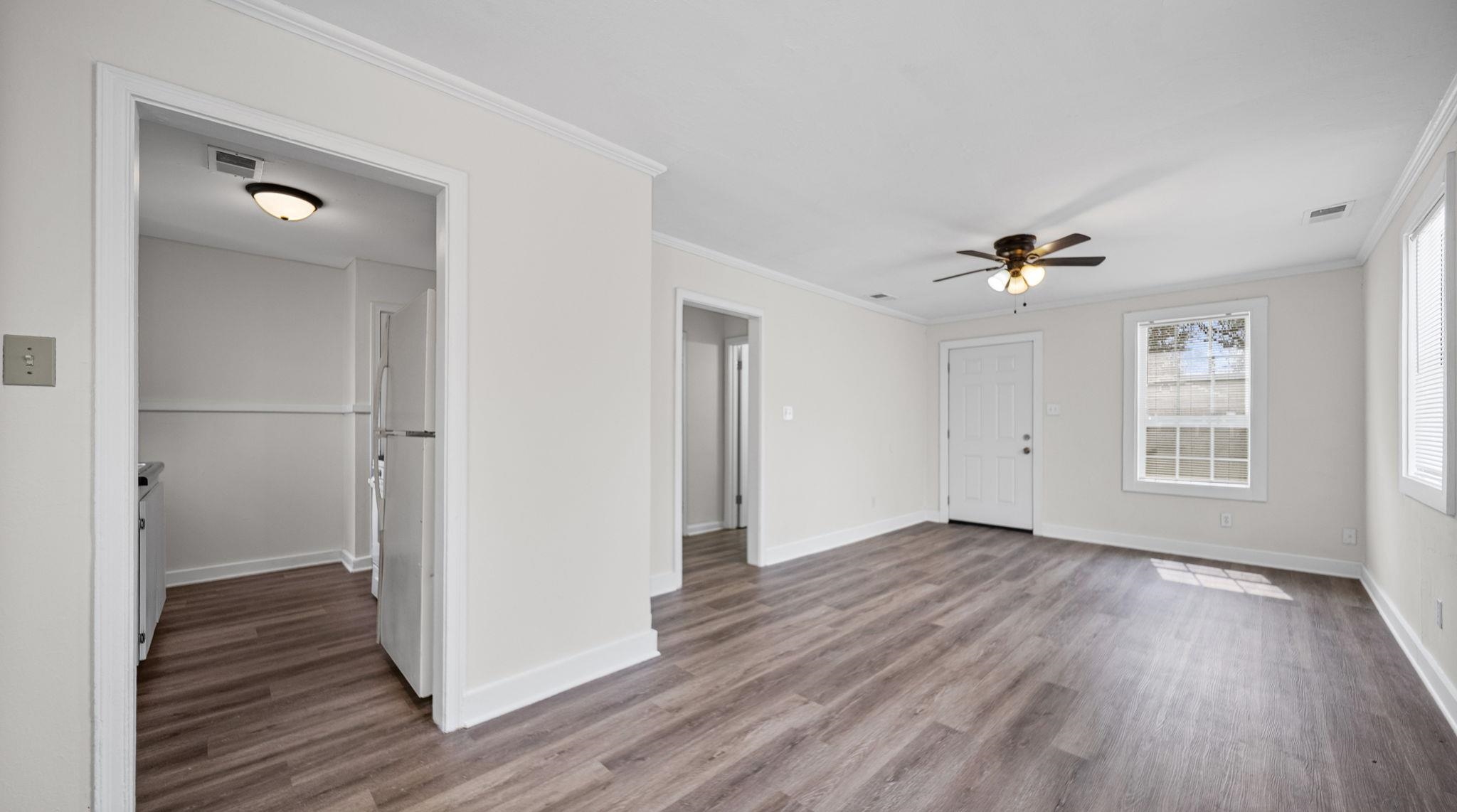 4408 Given Avenue Memphis, TN 38122 - Photo 7 of 16 wooden floor in an empty room with a window