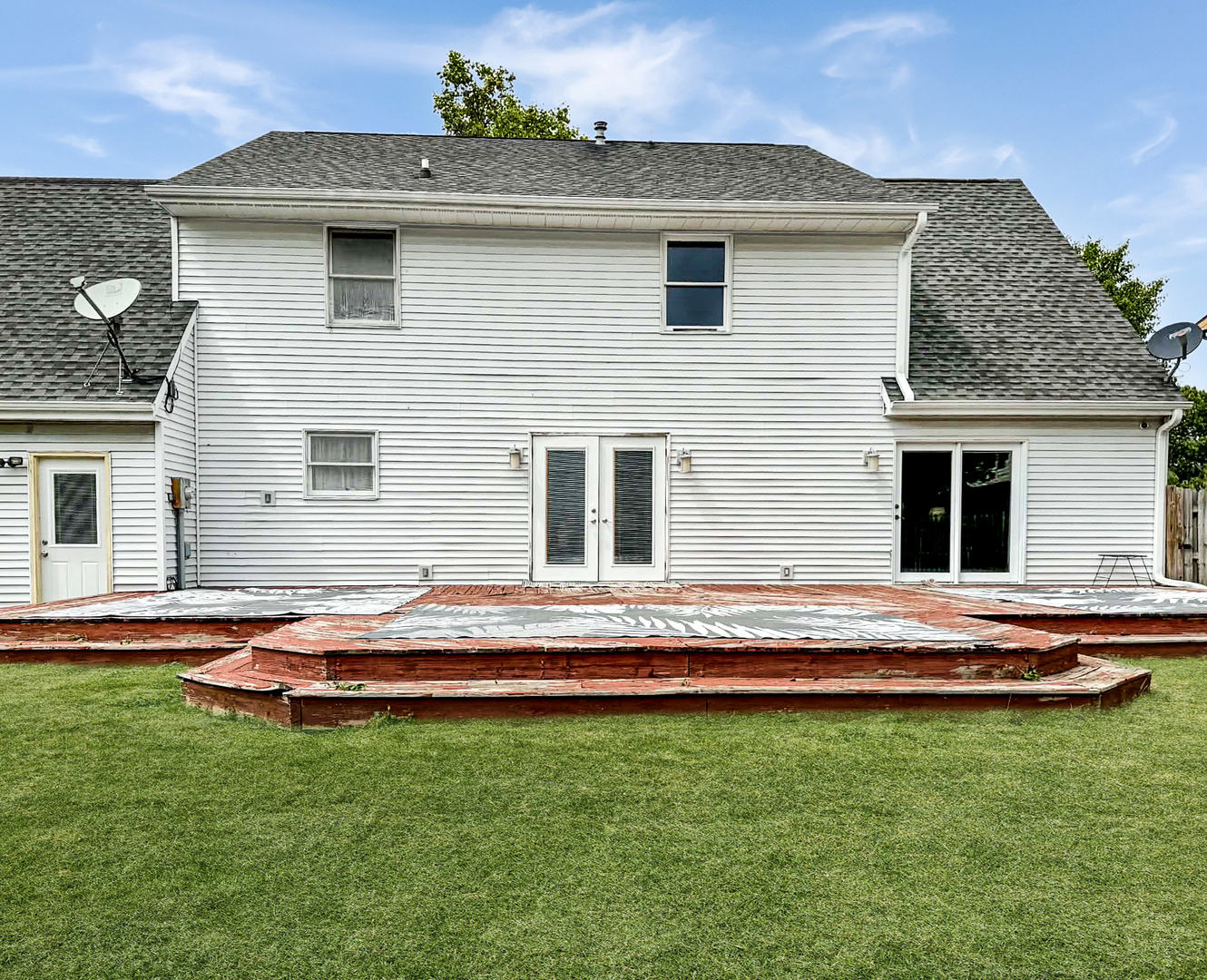1008 Ascot Drive Rantoul, IL 61866 - Photo 22 of 24 a backyard of a house with barbeque oven table and chairs