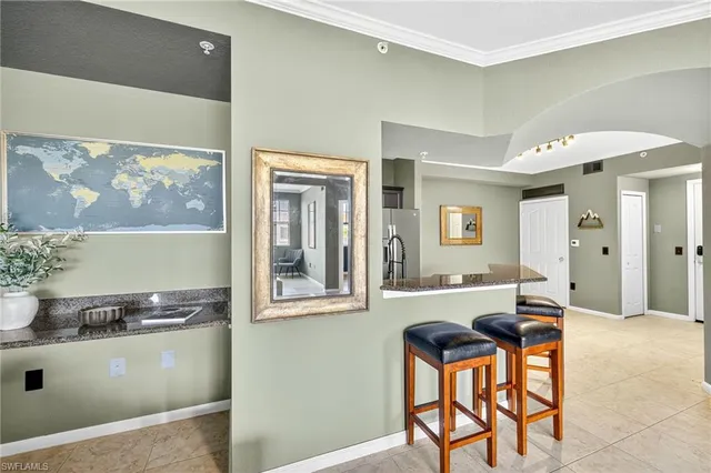 a dining room with a table and chairs